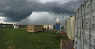 A dry-season rainstorm approaches the ARM Facility’s Mobile Aerosol Observing System (MAOS) located southwest of Manaus, Brazil, at the T-3 site in Manacapuru. The aerosol content of the atmosphere is often greater when conditions are dry, due to additional particulates from forest burning and other activities.
