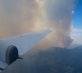 Inside Job: Studying Smoke and Fire at a Laboratory Scale
