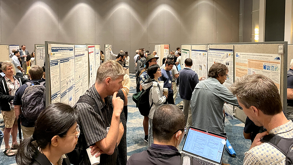 A crowd gathers during a poster session at the 2023 Joint ARM User Facility/ASR Principal Investigators Meeting in Rockville, Maryland. The annual meeting of ARM staff, facility users, and ASR scientists drew 421 attendees.