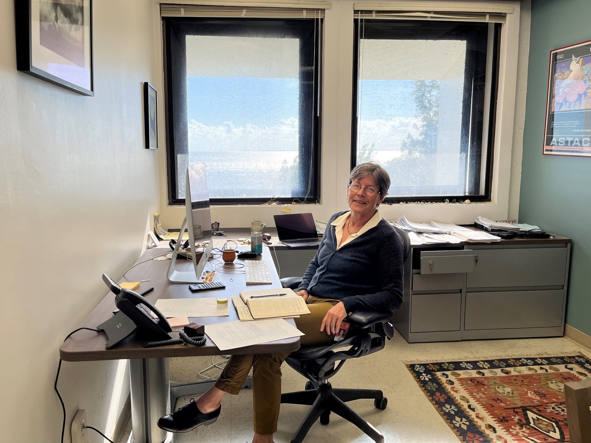 Self-described “cloud whisperer” Paquita Zuidema pauses in her office at the University of Miami’s Rosenstiel School Marine, Atmospheric, and Earth Science, which has its own campus on Biscayne Bay. “I like that you get a hint of what the view from my window is like,” she said on a day in mid-February 2023. Marine clouds, similar to those at Ascension Island, pile up in the distance. 