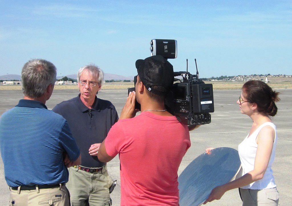 During the Pacific Northwest phase of the Biomass Burning Observation Project (BBOP) in 2013, Larry Kleinman (center, dark blue shirt) talks to the media about the ARM field campaign. Kleinman was a co-lead scientist for BBOP. 