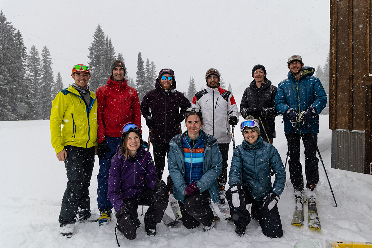 SOS team members gather at the Rocky Mountain Biological Laboratory in Gothic, Colorado, during the project’s intensive operational period in January 2023. In the top row, from left to right, are Mateo, Ethan Gutmann, Daniel “Danny” Hogan, Antonio Vigil, Will Nicewonger, and Eli Schwat. In the bottom row, from left to right, are Lundquist, Julie Vano, and Elise Osenga.