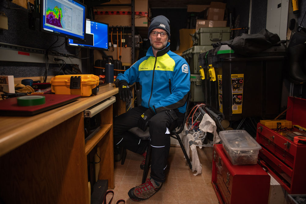 Matthew Shupe, the lead scientist for the MOSAiC ARM Mobile Facility deployment, takes a brief pause from working in his office in the bow of the Polarstern. Photo is by Esther Horvath, Alfred Wegener Institute (CC-BY 4.0).