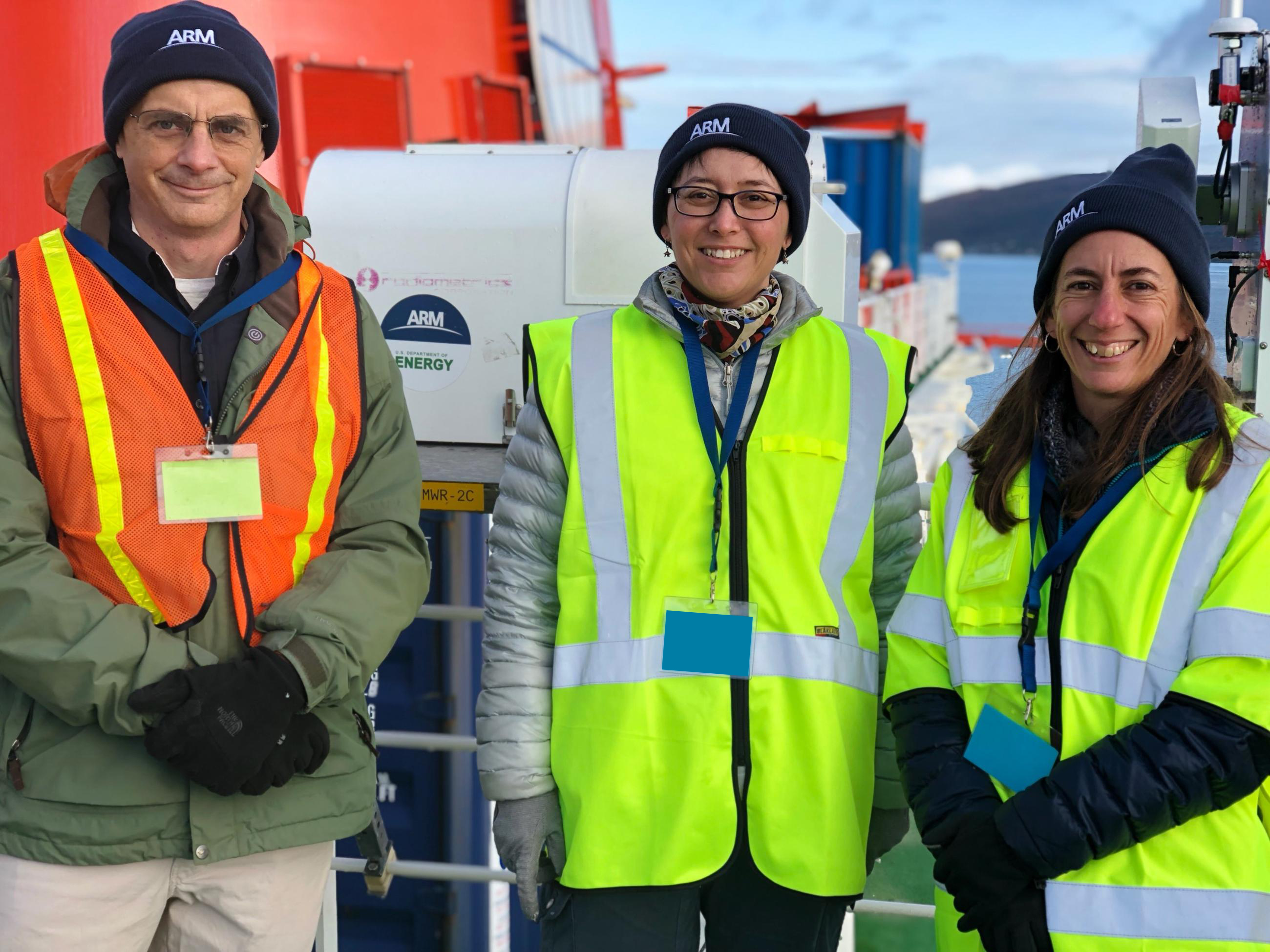 Before the launch of the Multidisciplinary Drifting Observatory for the Study of Arctic Climate (MOSAiC) field campaign, ASR Program Manager Shaima Nasiri is joined by ARM Technical Director Jim Mather (left) and ARM Program Manager Sally McFarlane (right).