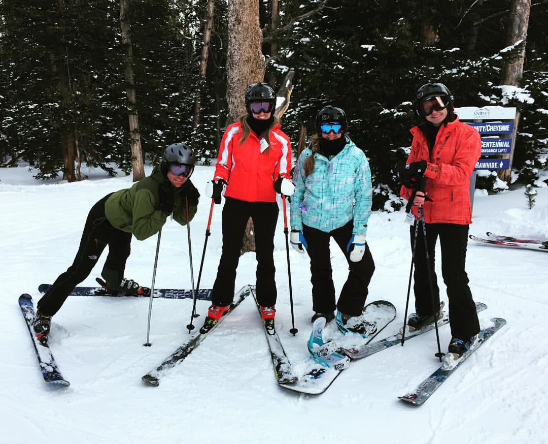In her spare time, outside of research and CrossFit, Sulia hikes and skis. On the slopes are, left to right, Zachary Lebo, sister Justine Sulia, Sulia, and mother Sherri Sulia.
