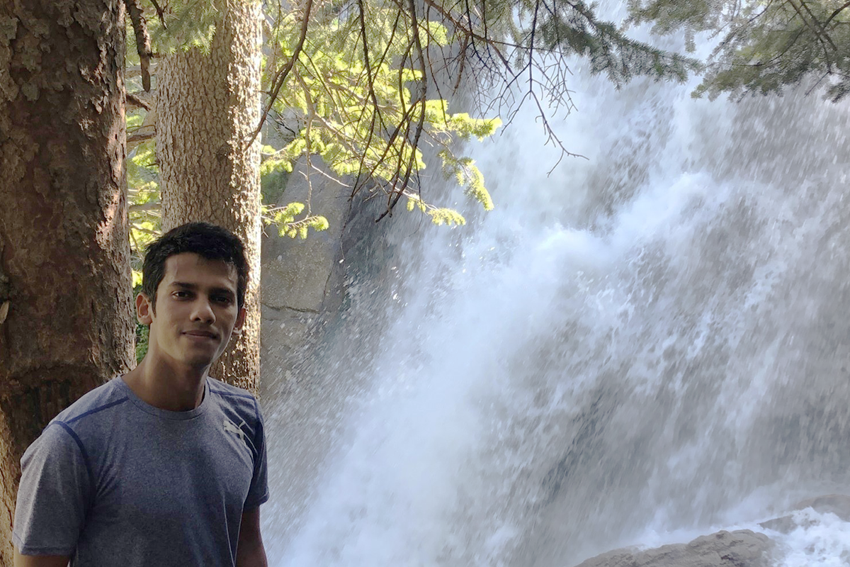 Ahmed poses in front of a waterfall in Little Cottonwood Canyon near Salt Lake City. 