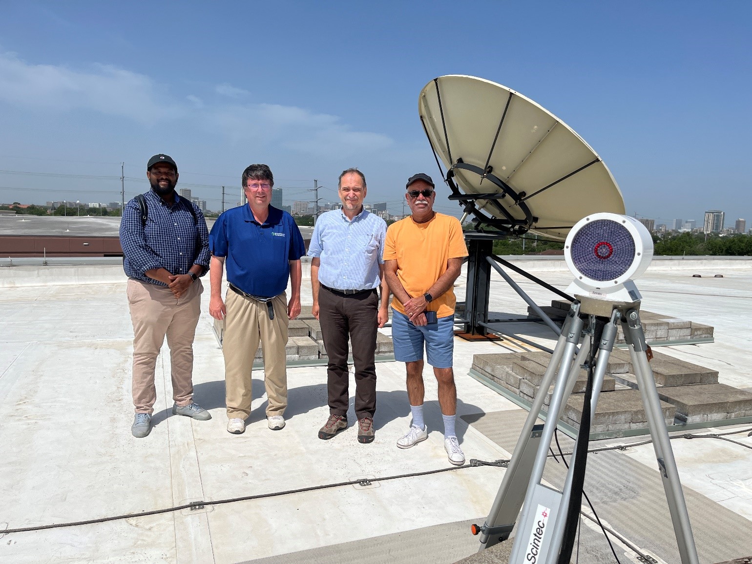 During TRACER, on top of the roof of the Spearman Technology Building at Texas Southern University (TSU), Vrinceanu, second from right, poses with TSU graduate student Aaron Taylor, TRACER PI Mike Jensen, and Victor Migenes, chair of TSU’s Department of Physics. 