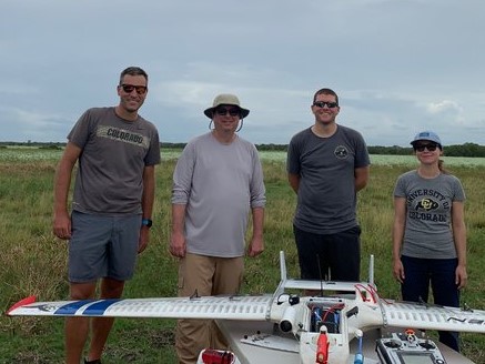 In the summer of 2022, de Boer, far left, joined his UAS team in Brazoria, Texas. Next to him is TRACER principal investigator Mike Jensen. In the foreground is a RAAVEN aircraft with its instrument bay open. Photo is courtesy of ARM.