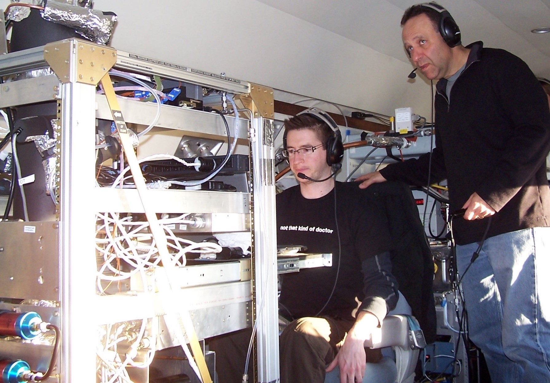 Paul DeMott, right, works aboard the Gulfstream-159 (G-1) during ARM’s CALWATER field campaign in 2011. Seated in front of him is Ryan Sullivan, then a postdoctoral researcher and now a professor at Carnegie Mellon University. He is operating a continuous flow diffusion chamber, an instrument DeMott helped develop and deploy.