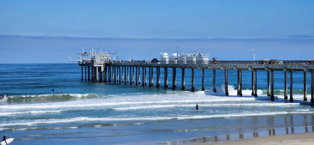 In June 2023, instruments along the Ellen Browning Scripps Memorial Pier collect measurements in the first of two intensive operational periods (IOPs) during the Eastern Pacific Cloud Aerosol Precipitation Experiment (EPCAPE) in La Jolla, California. Photo is by Nathan Wales, Los Alamos National Laboratory.