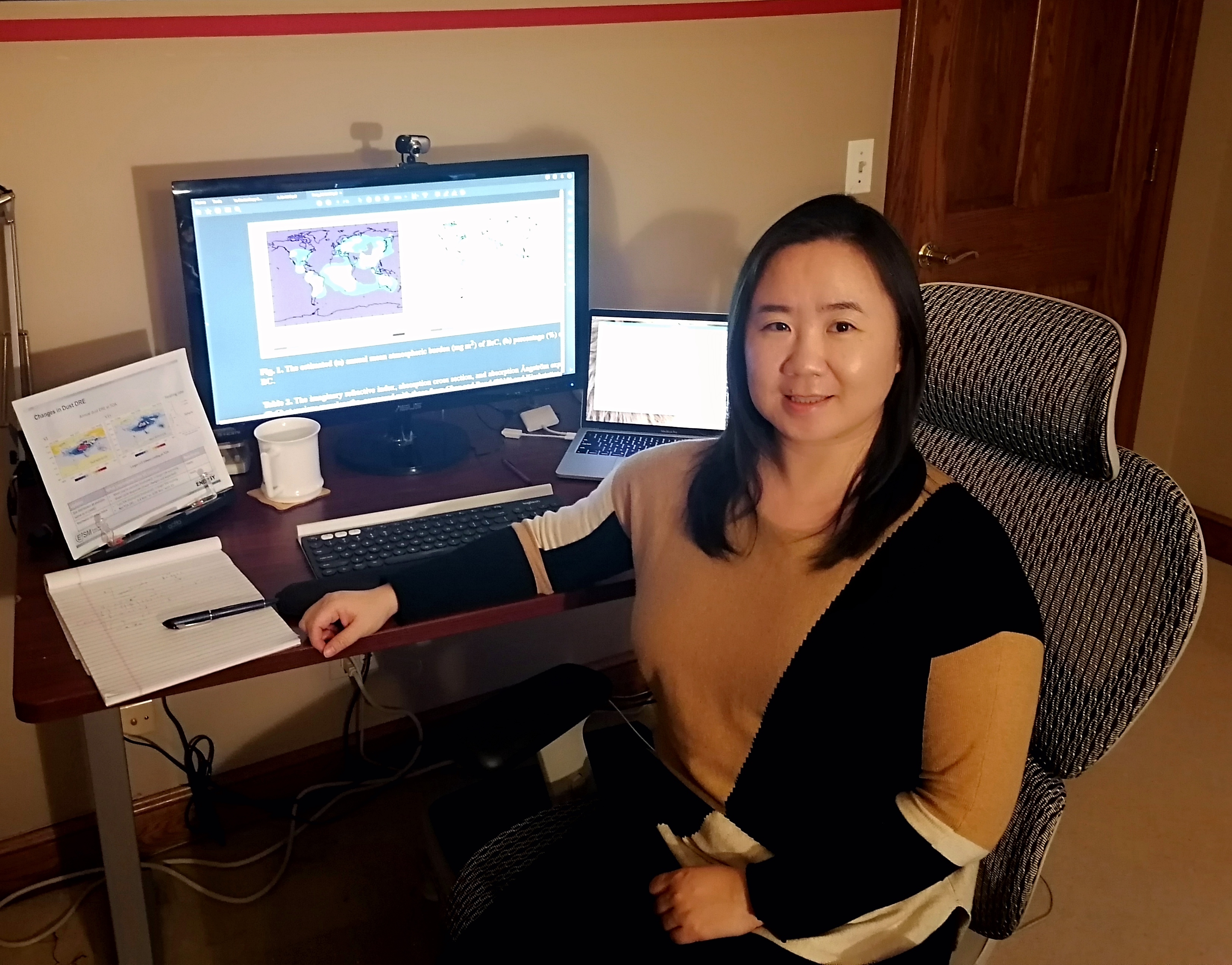 Early in 2021, Yan Feng pauses during work in her Chicago-area home office. 