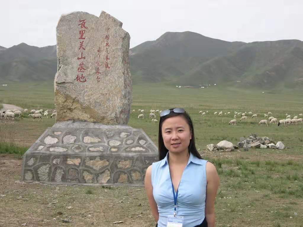 Yan Feng pauses during a summer 2006 trek to the remote and high Mt. Waliguan Observatory in China, a Global Atmosphere Watch station established to capture near-pristine atmospheric baseline conditions. It is also used by NOAA. 