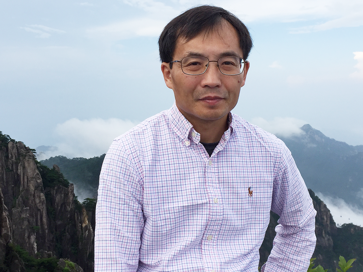 Away from his research, Zhien Wang enjoys outdoor activities, like hiking, that allow him to “enjoy nature and have a peaceful mind while observing dynamical cloud evolutions.” Behind him here is the Yellow Mountain range in China, where visitors can hike above the boundary-layer cloud top and watch cloud movements. 