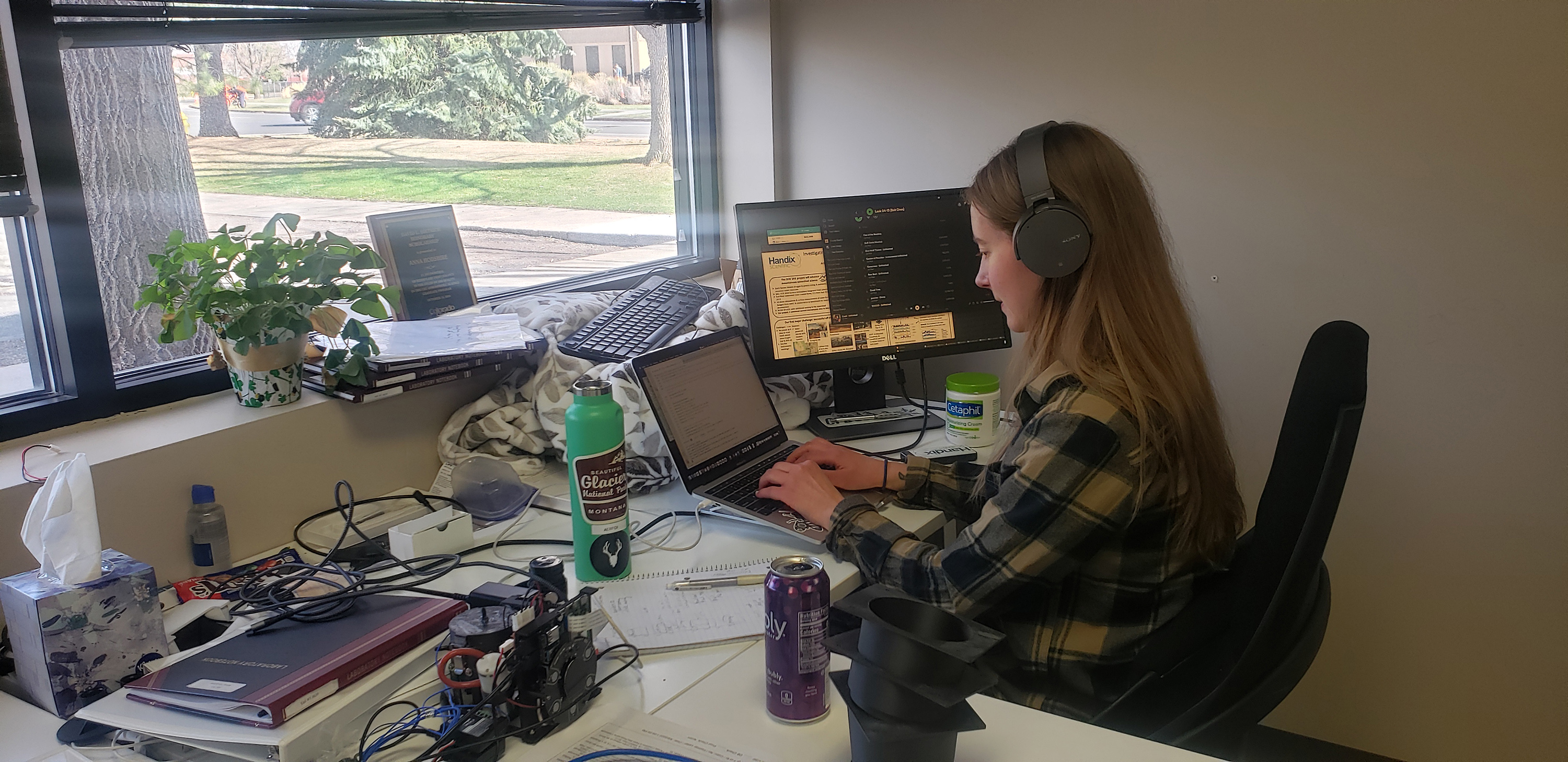 Modeler, mentor, data analyst, and observationalist Anna Hodshire in her office at Handix Scientific in Fort Collins, Colorado. “I work at my computer a lot,” she says. Photo is courtesy of Anna Hodshire.