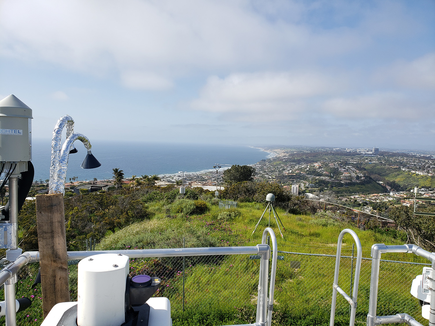 A view of the Pacific Ocean coastline in La Jolla, California, taken from where aerosol instruments are stationed atop Mt. Soledad. EPCAPE’s oceanside site, the Scripps Memorial Pier, appears as a thin white line in the middle distance. Photo by Smith.