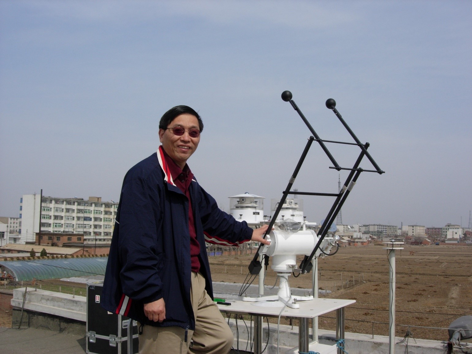 Zhanqing Li poses at a field site in China during AEROSOLINDIRECT, an ARM field campaign he led in 2008. Researchers investigated the effects of aerosols on what was then that country’s fast-changing atmosphere.