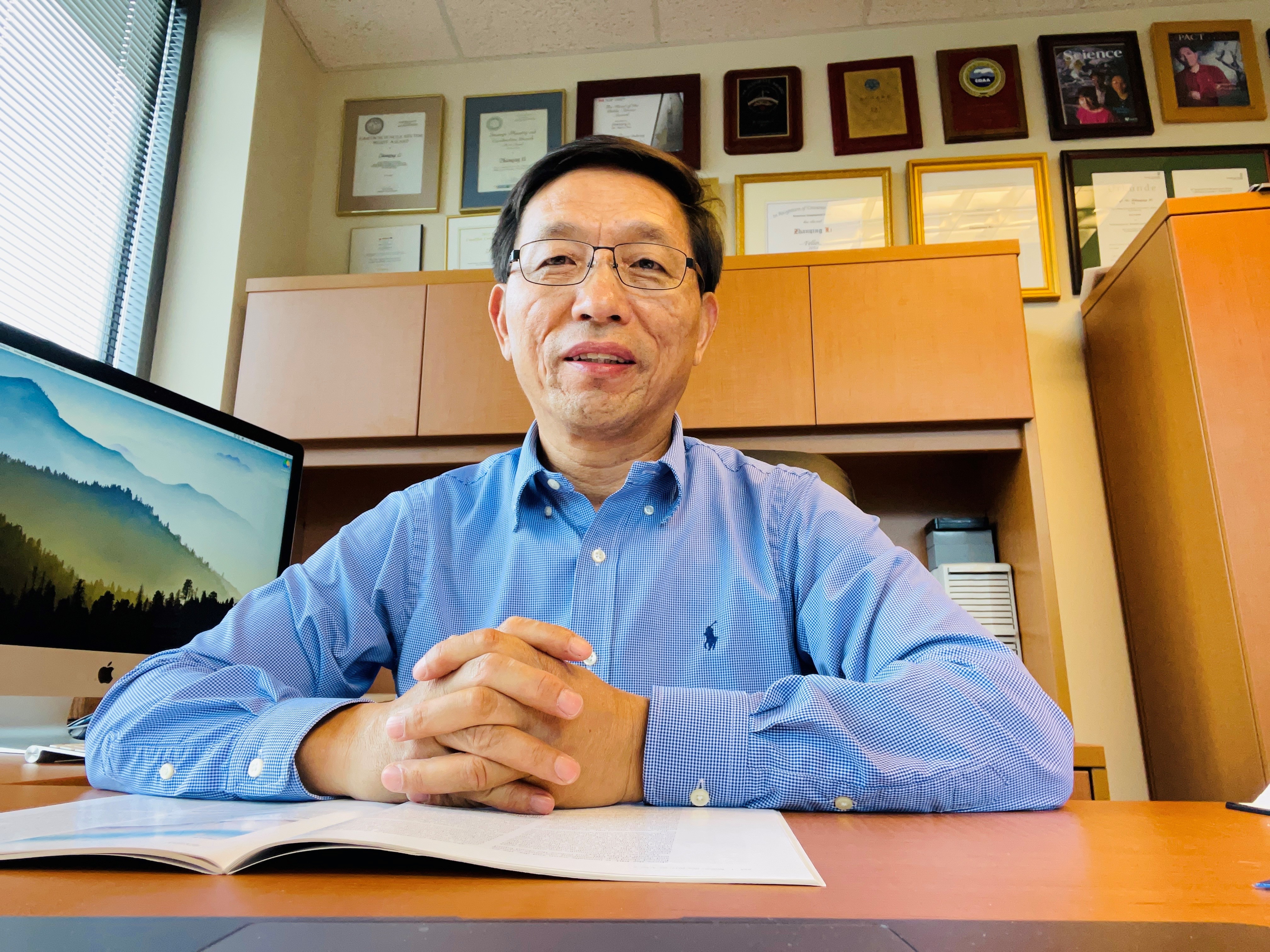 Zhanqing Li in his office in May 2021 at the University of Maryland, College Park. 