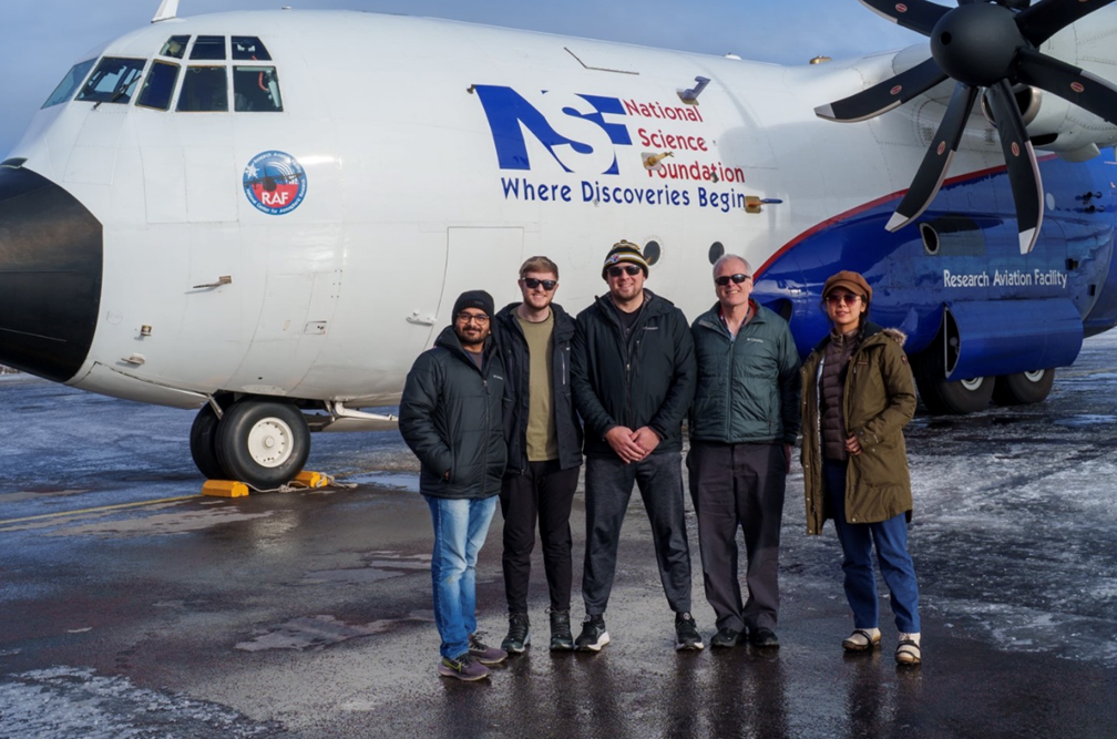 Members of McFarquhar’s Cloud Physics Group at the Cooperative Institute for Severe and High-Impact Weather Research and Operations (CIWRO) stand with the NSF NCAR C-130 research plane after a CAESAR flight on March 12, 2024. Pictured (left to right) are University of Oklahoma (OU) graduate student Saurabh Patil, OU graduate research assistant and master’s degree student Nick Amundsen, CIWRO research scientist Andrew Dzambo, McFarquhar, and OU PhD student Qing Niu.