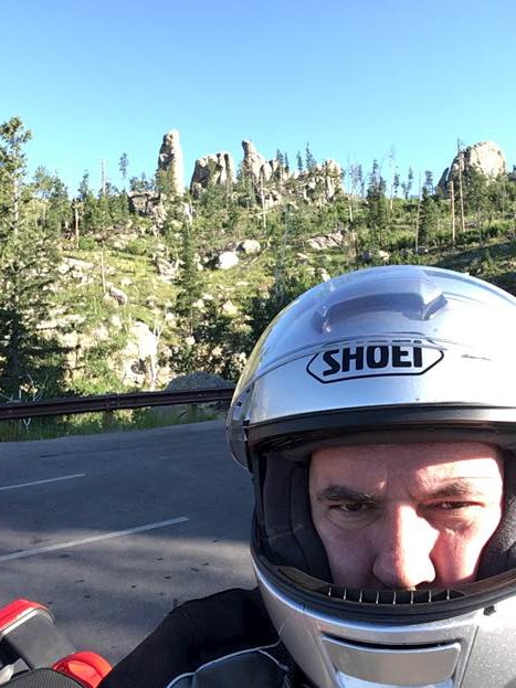 In life outside science, Mechem is (among many other things) an adventure motorcyclist. Here he is, pausing along Needles Highway in South Dakota. Photo is courtesy of Mechem. 