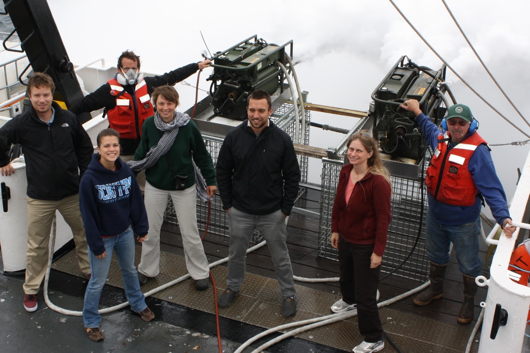 Climate scientist Lynn Russell is second from right in this July 2011 at-sea portrait during the Eastern Pacific Emitted Aerosol Cloud Experiment (E-PEACE) while generating aerosols to track aerosol-cloud interactions. With her aboard the R/V Point Sur, left to right, are Lars Ahlm (a Scripps postdoc, now at Stockholm University), Amanda Frossard (Scripps PhD student, now at University of Georgia), Johannes Muelmenstaedt (a Scripps postdoc, now at PNNL), Anna Wonaschutz (University of Arizona graduate student, now at the University of Vienna), Rob Modini (a Scripps postdoc, now at the Paul Scherrer Institut in Switzerland), and Tom Maggard (a Scripps engineer). 