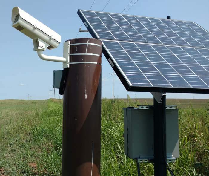 A stereocam looks up to the sky at the Southern Great Plains atmospheric observatory. In pairs about 120 degrees apart, and calibrated at prescribed angles, such digital camera setups are used to reconstruct the shape, height, and upward velocity of clouds. 