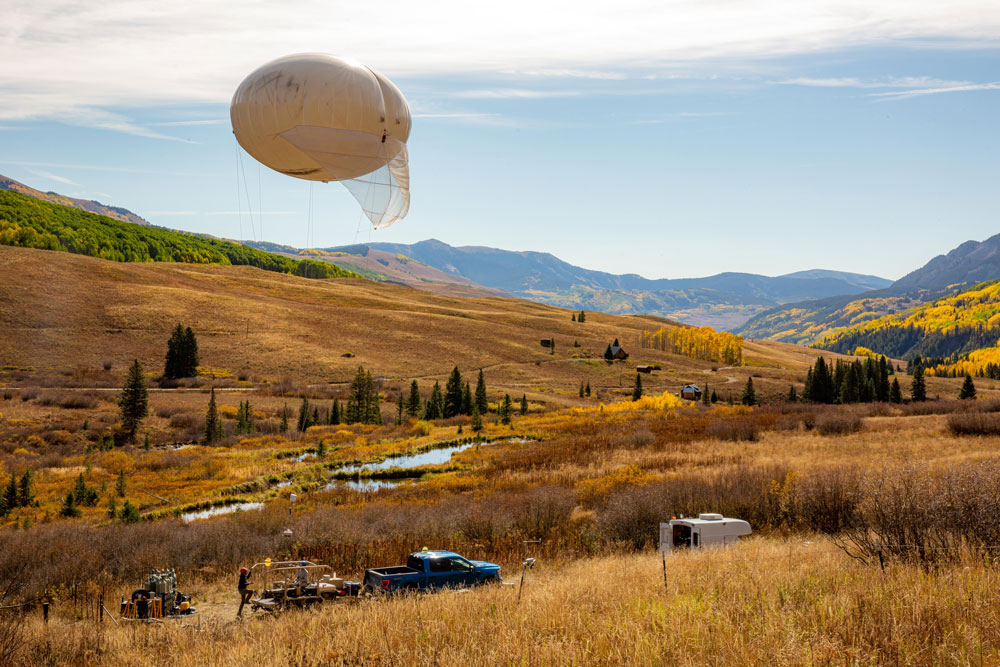 ARM is periodically flying tethered balloon systems at SAIL to measure profiles of temperature, humidity, and aerosols. Researchers can directly relate SAIL surface measurements with data collected throughout the planetary boundary layer. Photo from September 2021 is by Brent Peterson, Sandia National Laboratories.