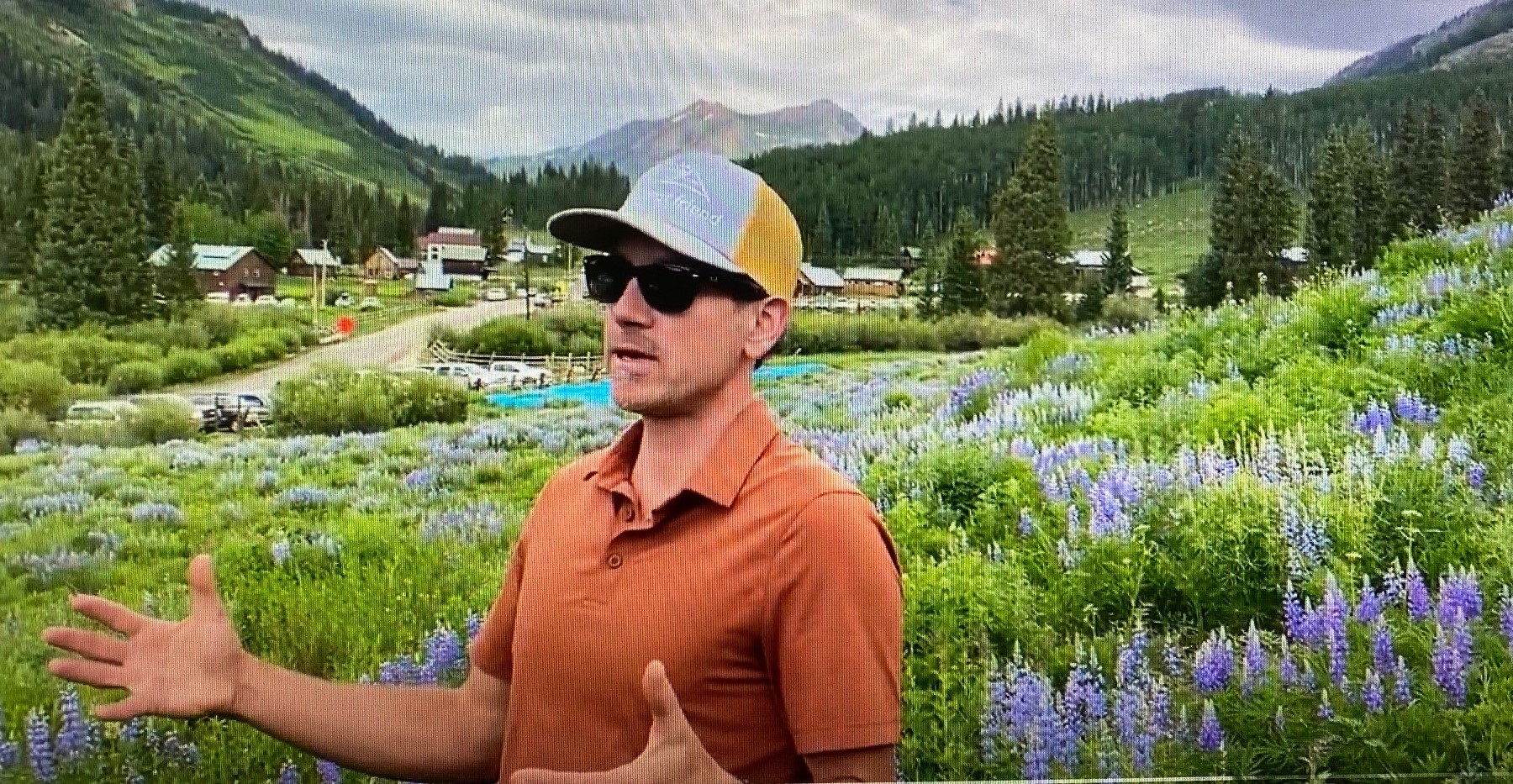 In this June 2021 screengrab from an ARM video, with Gothic, Colorado, in the background, SAIL co-investigator Kenneth Williams explains instrument placement to a YouTube audience.