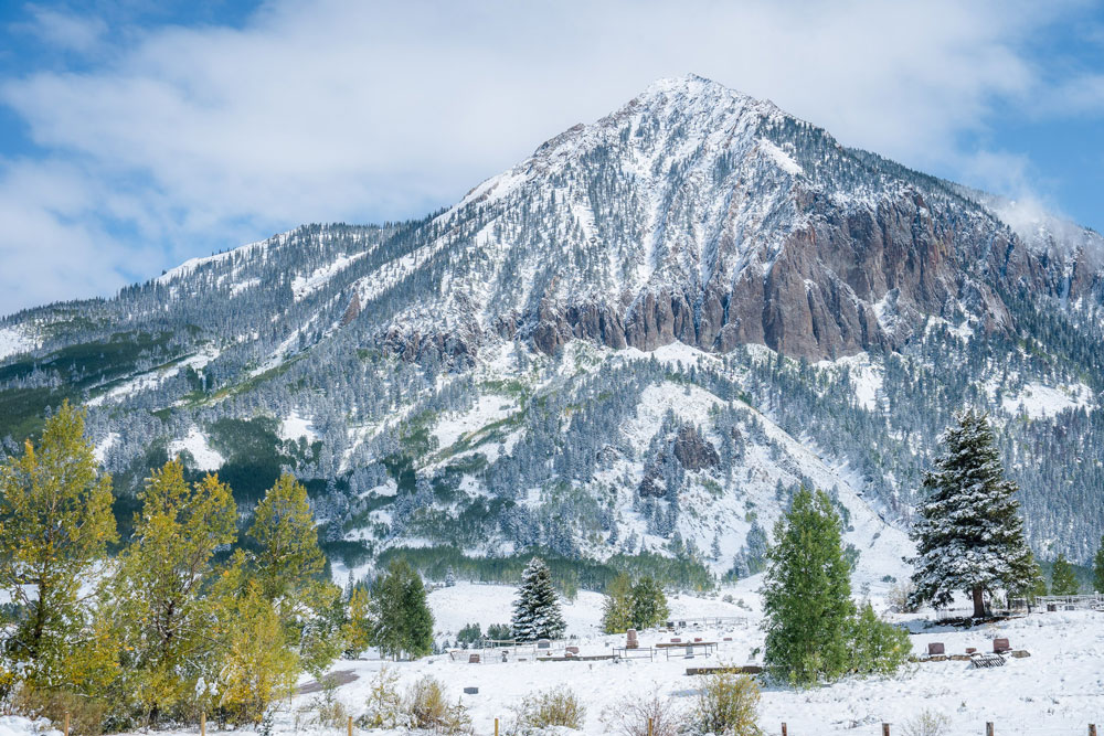 In Colorado, snow blankets Gothic Mountain in December 2021. How mountains acquire, store, and release water depends on an interlocking set of complex processes in the atmosphere, soils, vegetation, and subsurface. Photo is by Jeremy Snyder, Lawrence Berkeley National Laboratory (LBNL).