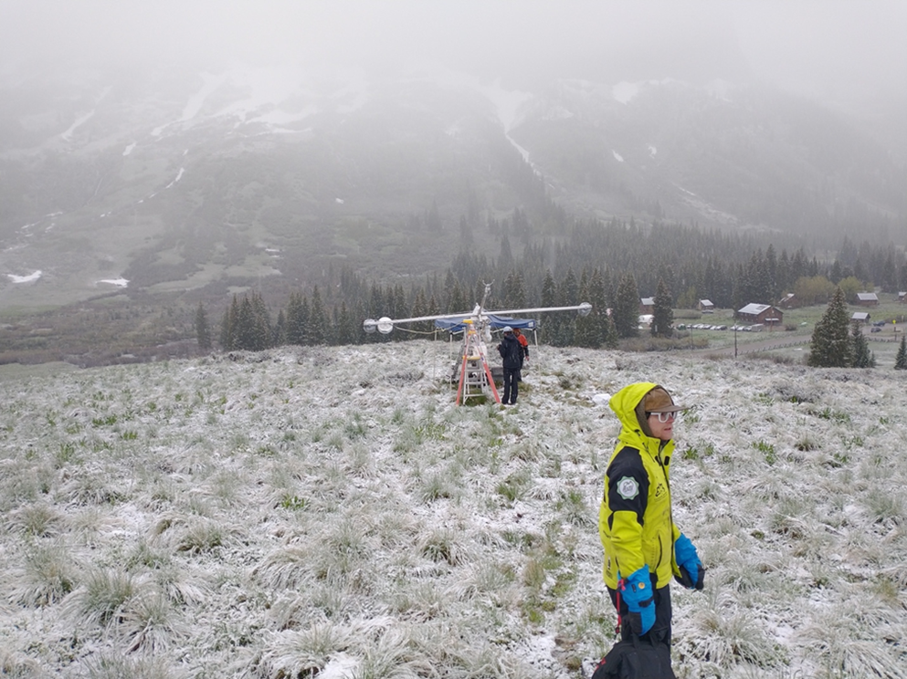 In June 2023, on Day Two of packing up SAIL instruments, technician Frank Zurek walked through a touch of winter still hanging on near Crested Butte. Photo is by Travis Guy, Hamelmann Communications.