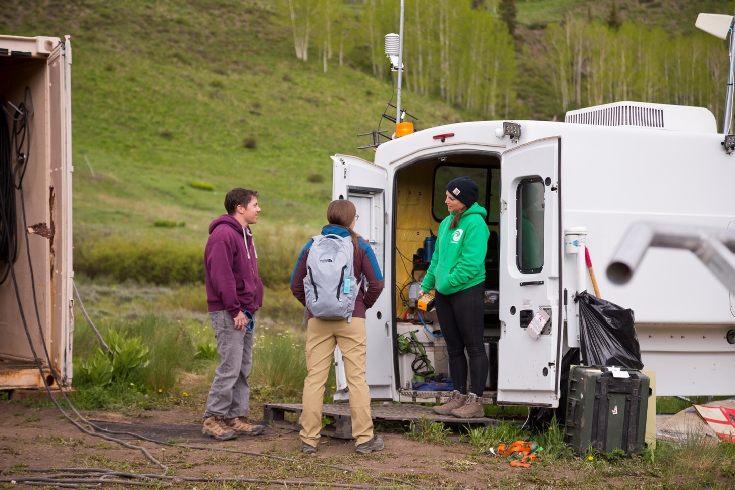 In June 2023, Feldman (left) and Aiken (center) discuss tethered balloon system strategies with expert Dari Dexheimer. Photo is by Bilow.