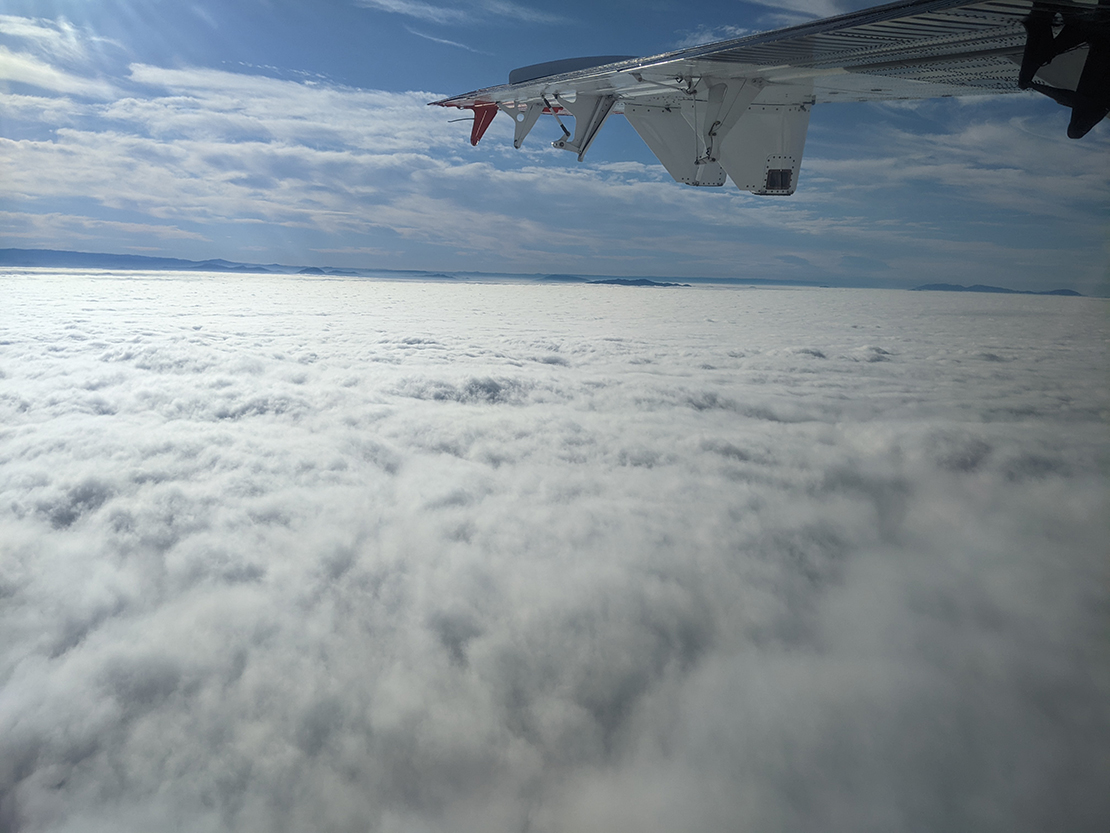 On June 19, the coastal mountains of San Diego County peek through marine stratus, creating the appearance of islands among a sea of clouds. SCILLA flights were designed to capture the retreat of stratus from the coast during the morning. Photo is courtesy of Patrick Chuang, University of California, Santa Cruz.