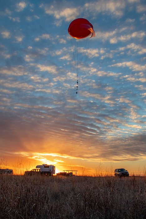 A tethered balloon system is aloft at the Southern Great Plains (SGP) site near Marshall, Oklahoma, in February 2021. More flights will take place at the SGP in 2022. Photo is by Brent Peterson, Sandia National Laboratories.