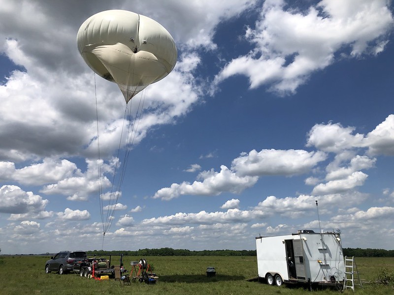 A tethered balloon system is winched into the sky in Guy, Texas, as part of TRACER. It represented one of many instrument platforms deployed during the yearlong campaign. Photo is by Brent Peterson, Sandia National Laboratories.