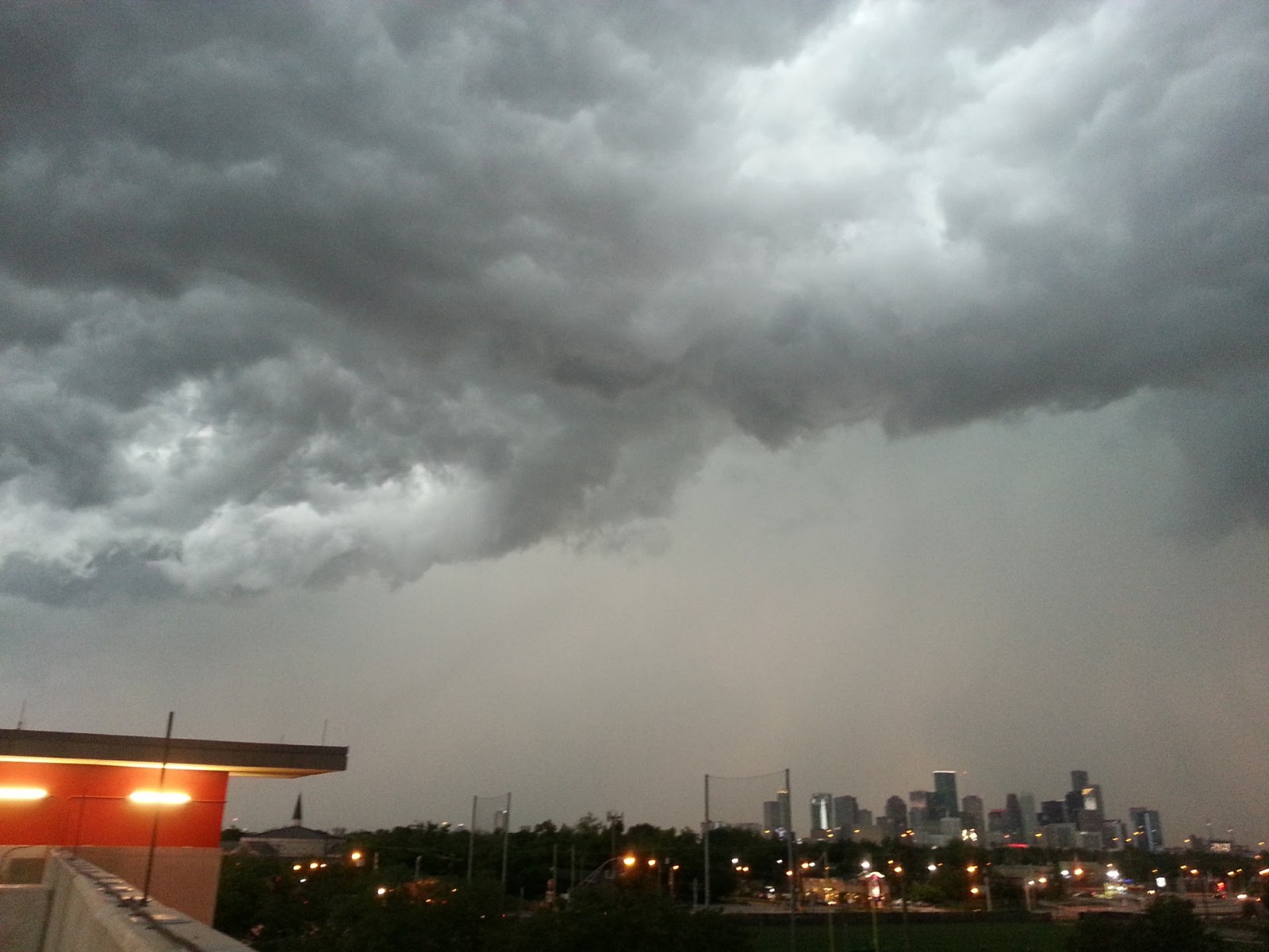 The cloud-gray Houston, Texas, skyline, right, is the backdrop for the 2021–2022 TRacking Aerosol Convection interactions ExpeRiment (TRACER). Photo is by Alex Kotsakis, now at ERT Inc.
