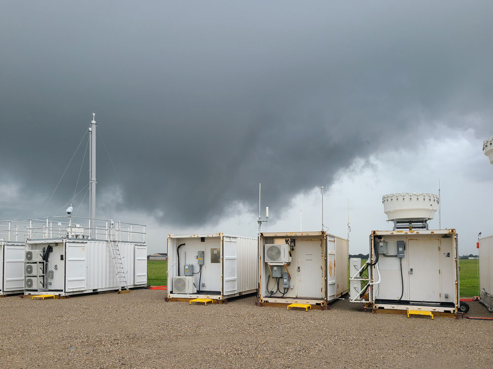 On October 1, 2021, the first official day of operations for TRACER, this ARM Mobile Facility in La Porte, Texas, recorded data on storm clouds and the surrounding environment. Photo is by David Oaks, Los Alamos National Laboratory.