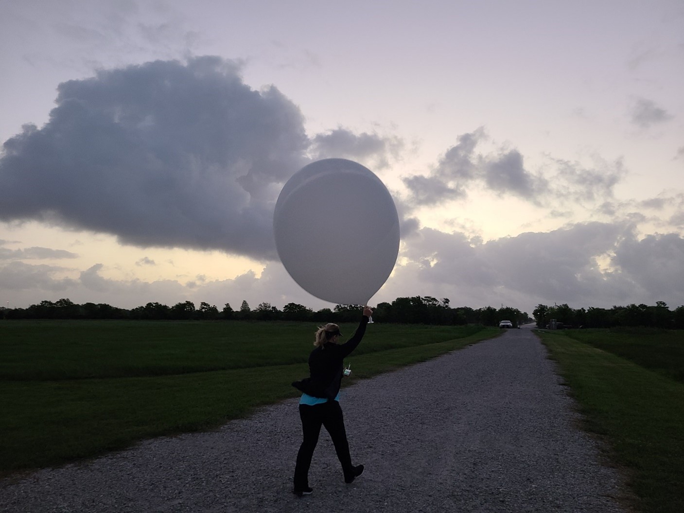 ARM releases a weather balloon from its La Porte site every six hours. On the morning of April 23, 2022, Michelle Kiani launches a balloon at the site. Photo is by Mark Spychala, Hamelmann Communications.