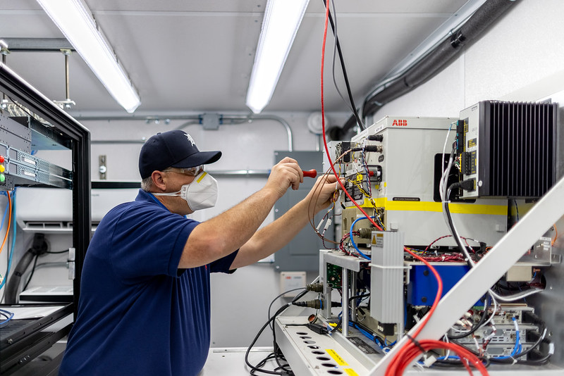 In September 2021 in La Porte, ARM technician David Oaks works on a TRACER instrument that measures vertical profiles of atmospheric temperature and humidity. Photo is by Ben Corda, University of Houston.