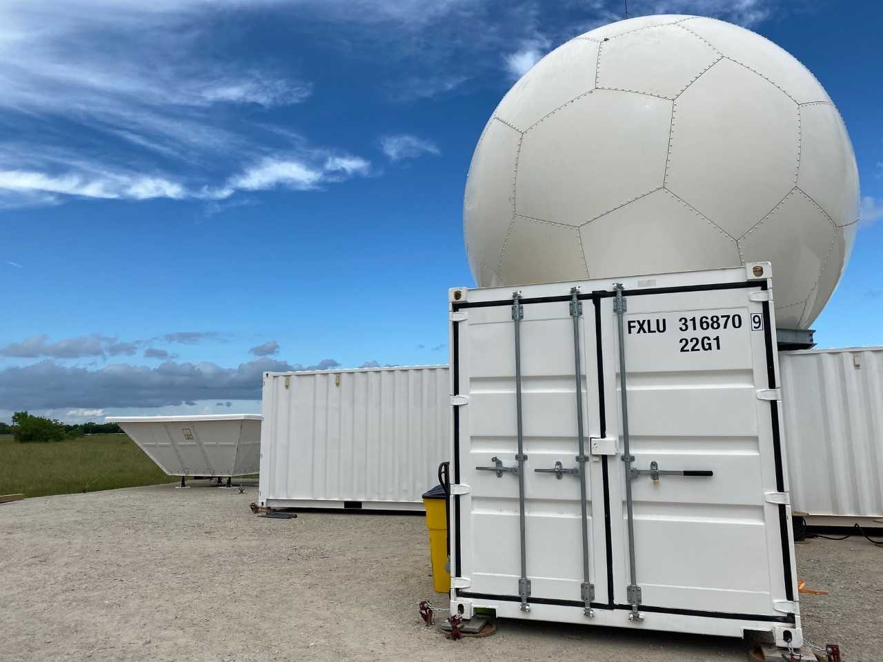 TRACER is the second deployment for the second-generation C-Band ARM Precipitation Radar. The radar started life with an ARM field campaign in Argentina and is now in Pearland, Texas, above. It can produce three-dimensional (3D) images of evolving convective systems. A radar wind profiler is visible to the left. Photo is by Jillian Sandoval, Los Alamos National Laboratory.