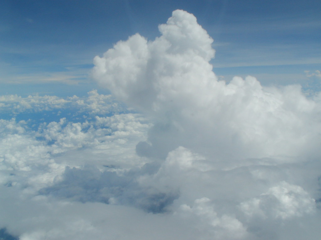 Clouds rise above the tropical western Pacific Ocean. Photo is courtesy of Atmospheric Radiation Measurement (ARM). 