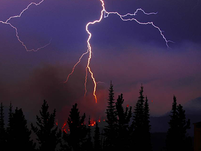 Lightning above a wildfire in Alberta, Canada. Photo courtesy of the Government of Alberta.