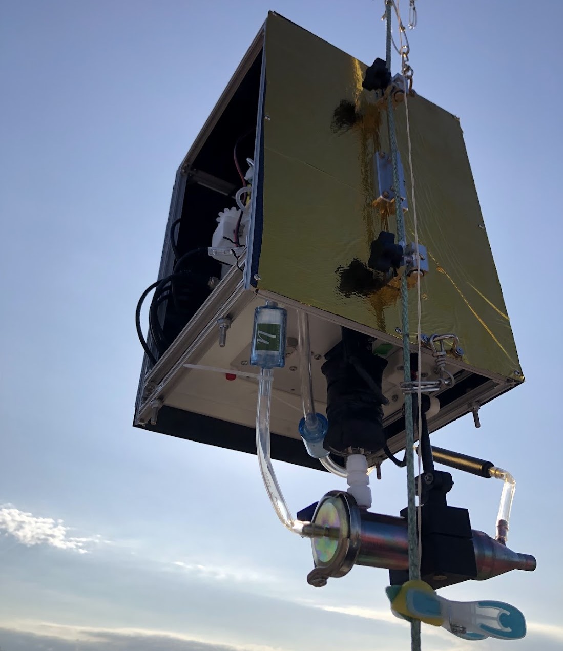 Mounted on a balloon tether, this reactive condensation particle counter, developed by Jen and her research group at Carnegie Mellon University, gets hoisted into the sky in June 2024 at the SGP.