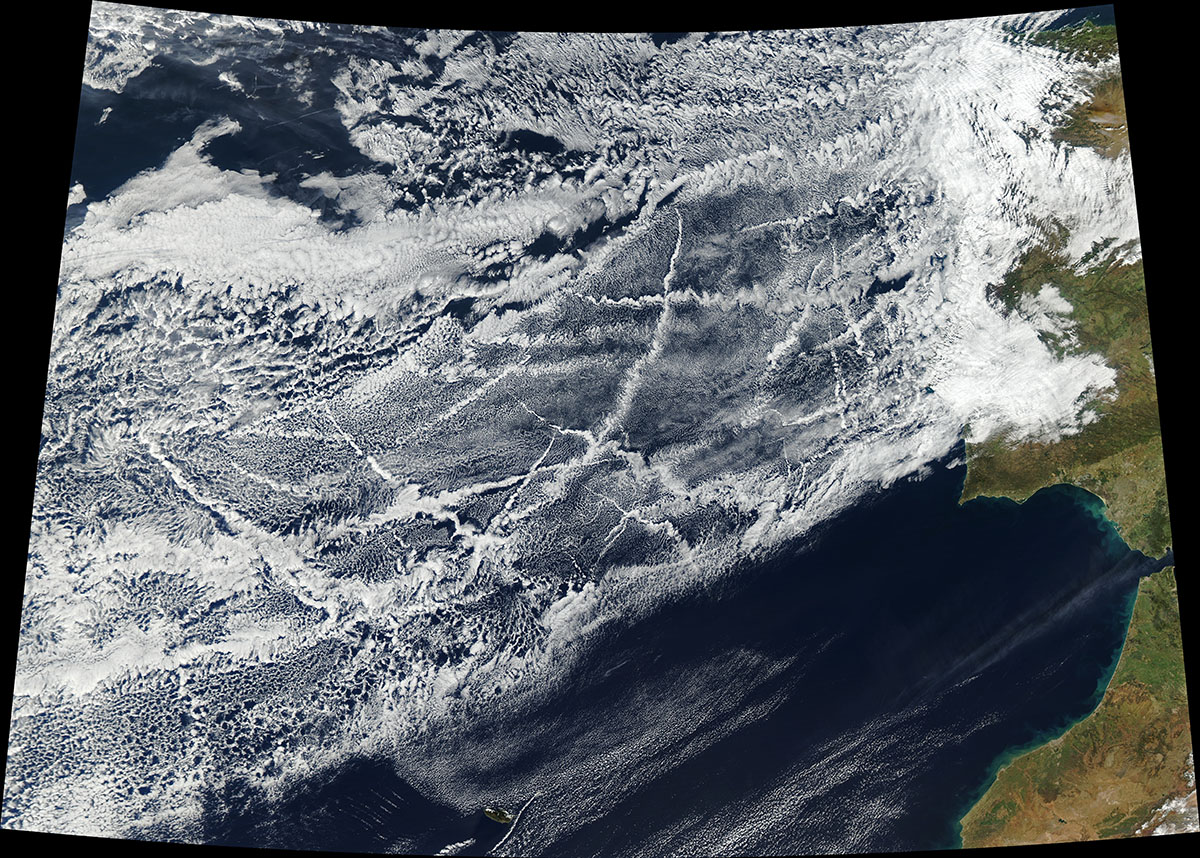 In this 2018 satellite view, sulfur-rich ship exhaust in the Atlantic Ocean off Portugal and Spain created a patchwork of bright “ship tracks” reflective enough to have a cooling effect. Scientists are investigating the impacts of low-sulfur fuels required since 2020. 